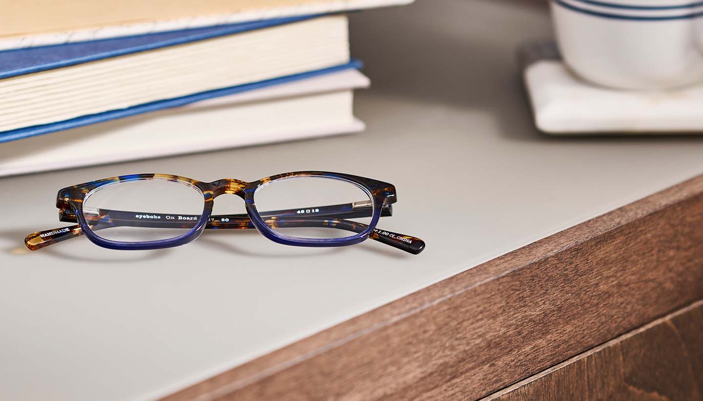 tortoise shell eyeglass frames on a counter top