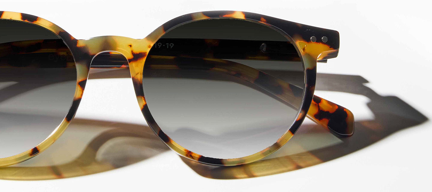 turtle shell transition lense glasses on a white surface