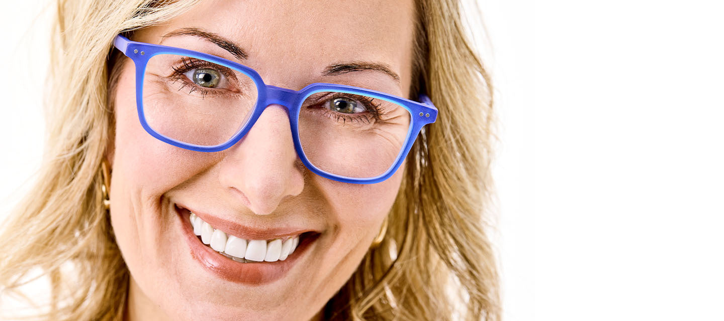 woman wearing blue framed glasses