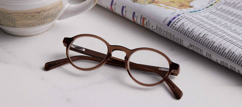round glass frames on a white marble counter