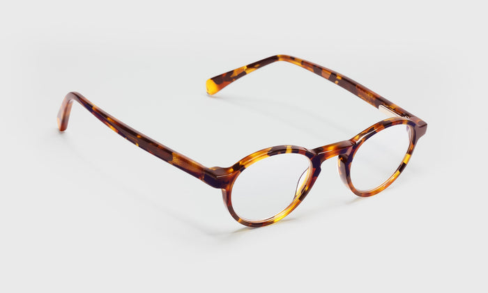 19_eyebobs premium designer board stiff readers, blue light and prescription glasses in tortoise front and temples, angle