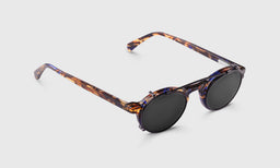 gallery position 1 tortoiseshell round Board Stiff clip-on sunglasses with black polarized lenses on light gray background
