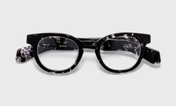 00 | Total Wit lay down eyeglass frames on neutral background