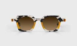 Chutzpah'd Sunglasses with italian-designed acetate frame in black, white, and amber hues and polarized brown scratch resistant lenses