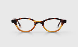 Oval eyeglasses with tortoise to amber gradient acetate frame and temples on a light gray backdrop