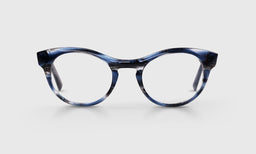 Cat-eye acetate eyeglasses with dark and stormy blue marbled front frame and matching temples on light gray background