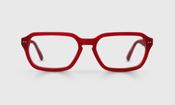 Wide rectangular acetate eyeglasses with matte crimson front and temples on a light gray background