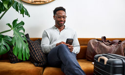 man wearing eyebobs oversized square reading glasses in black and creamt ortoise