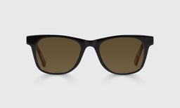 00-pb | The Director brown polarized sunglass frames on neutral background