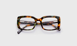 eyebobs bold wide square eyeglasses in teal blue tortoise, laid flat with temples visible
