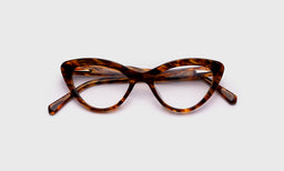eyebobs vintage cat-eye eyeglasses in brown patterned, laid flat with temples visible