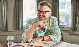 Man photographed in So Decisive eyeglass frames as part of a portrait series
