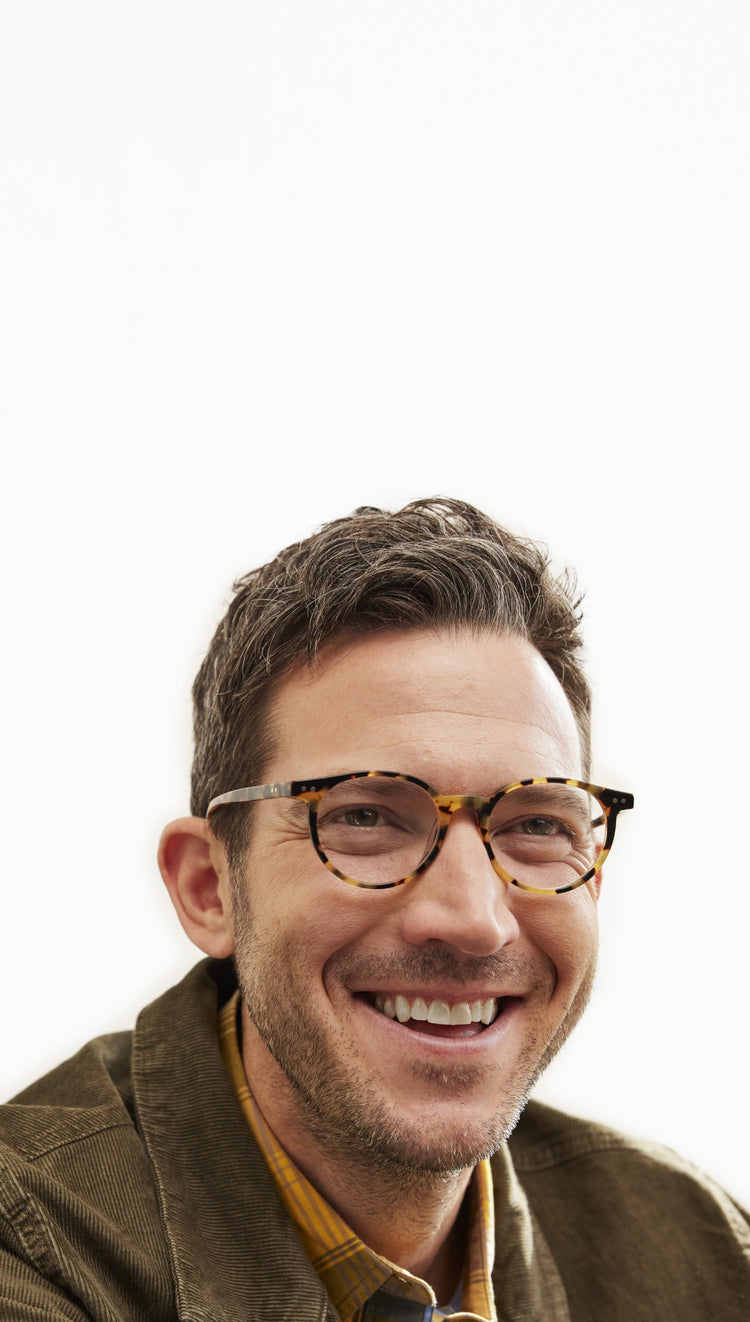 Model Wearing Case Closed in Tortoise