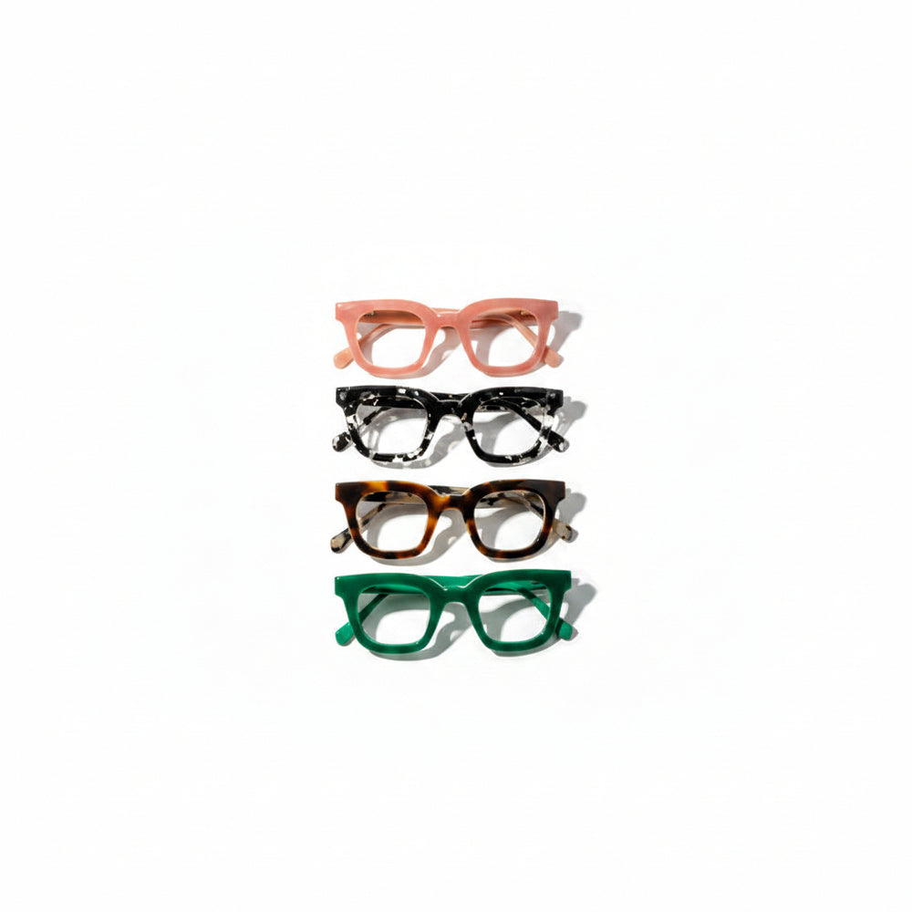 Four pairs of cat-eye glasses in different colors on a white background