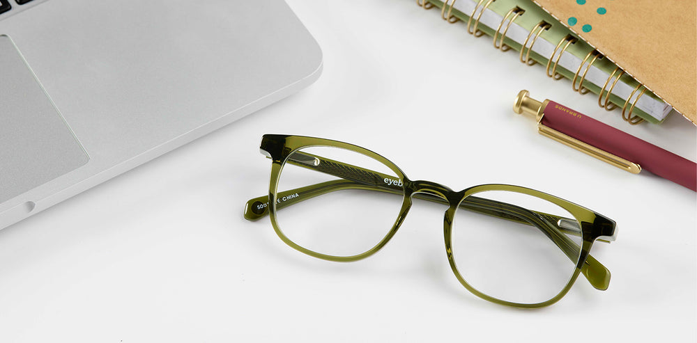 boardroom glasses on desk with laptop