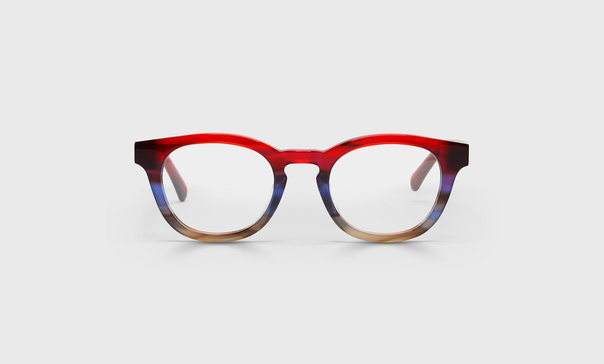 Wide unisex round reading glasses with red to blue fade front and solid red demi temples on light gray background