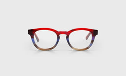 Wide unisex round reading glasses with red to blue fade front and solid red demi temples on light gray background