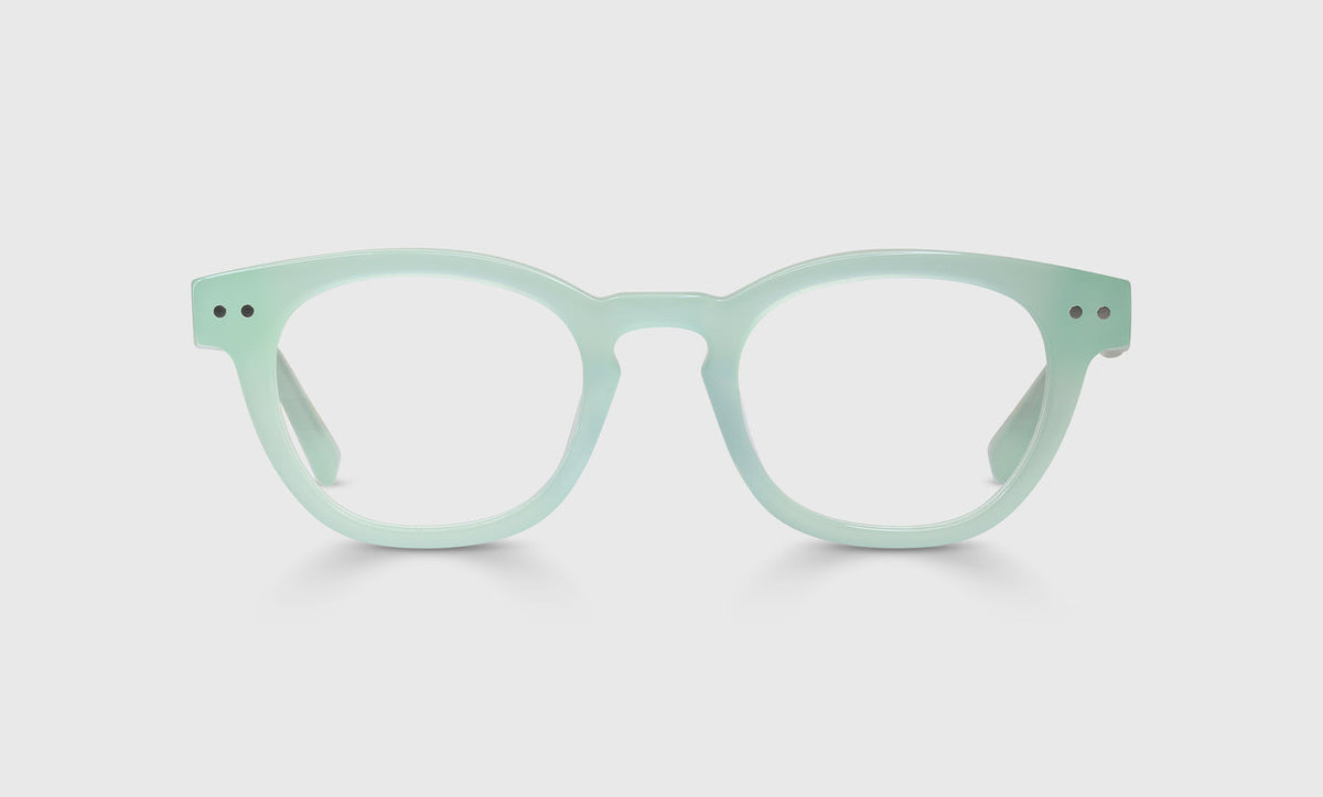 Unisex Waylaid style round eyeglasses with milky mint acetate frame and matching temples on a light gray background