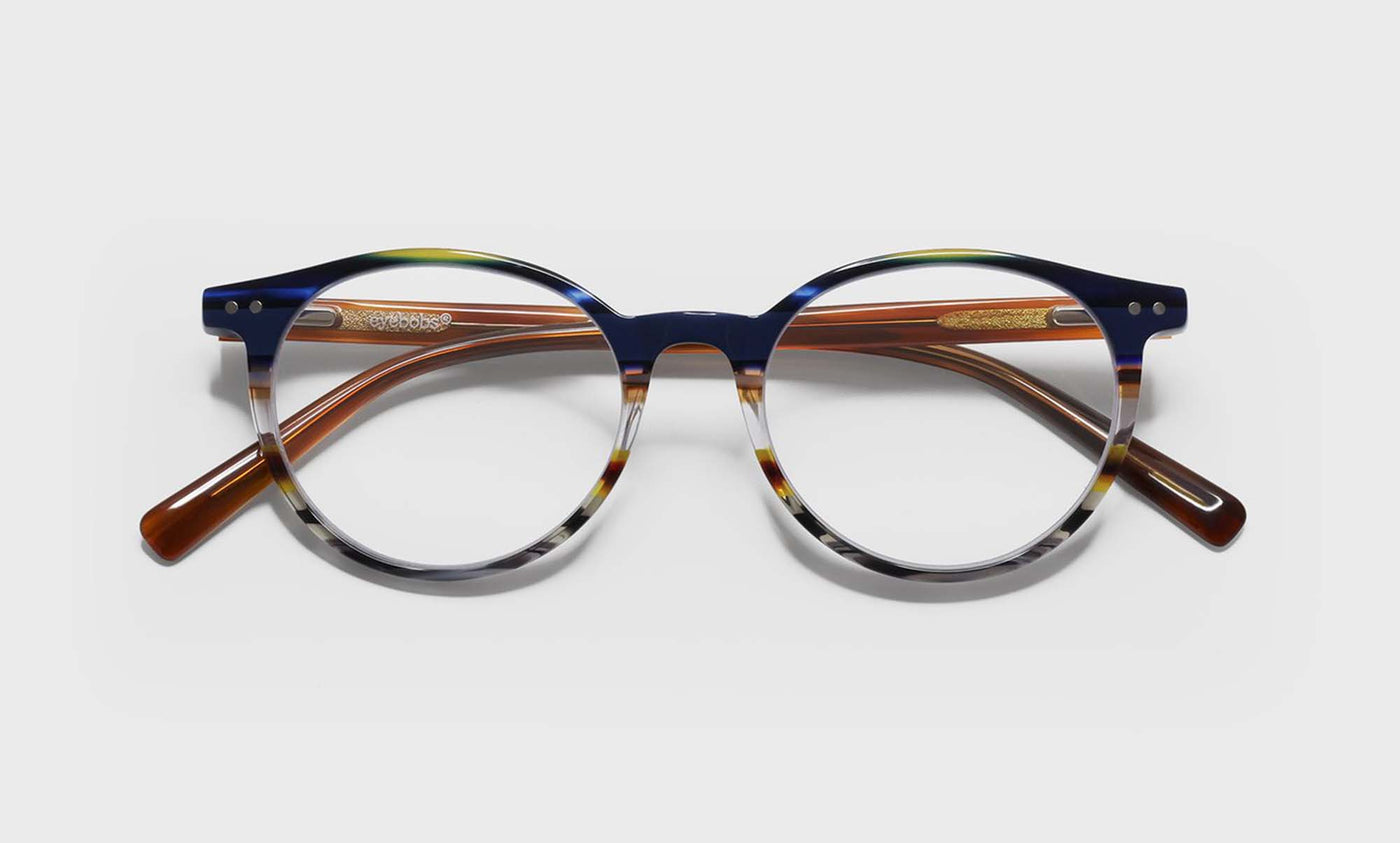 57_eyebobs premium designer case closed readers, blue light and prescription glasses in blue multi stripe