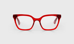 Narrow women's cat-eye prescription glasses with translucent red crystal frame and temples on a light gray background