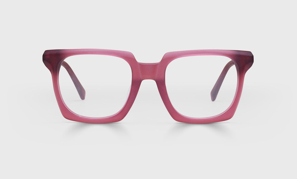 Square acetate eyeglasses with milky burgundy front fading to darker tips and light gunmetal temples on gray background