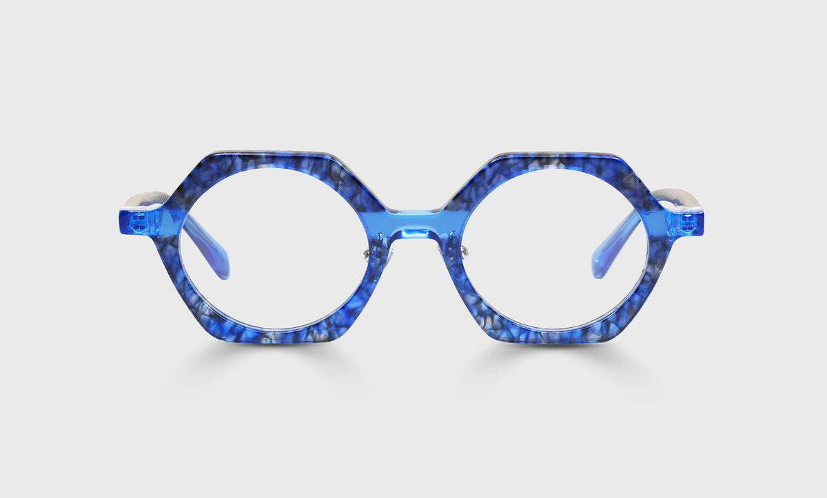 Unisex round octagonal eyeglasses with shiny blue marbled acetate front and translucent blue crystal temples on white background