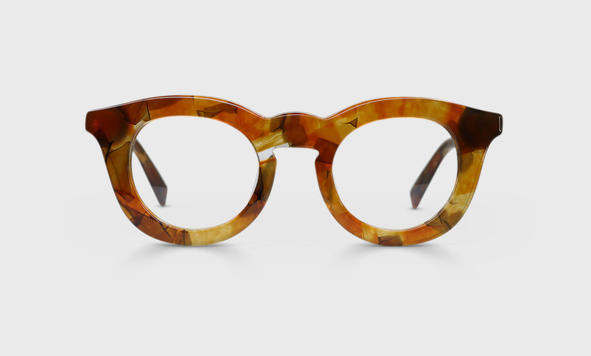 Unisex round eyeglasses with marbled orange acetate frame front and temples on a pale gray background
