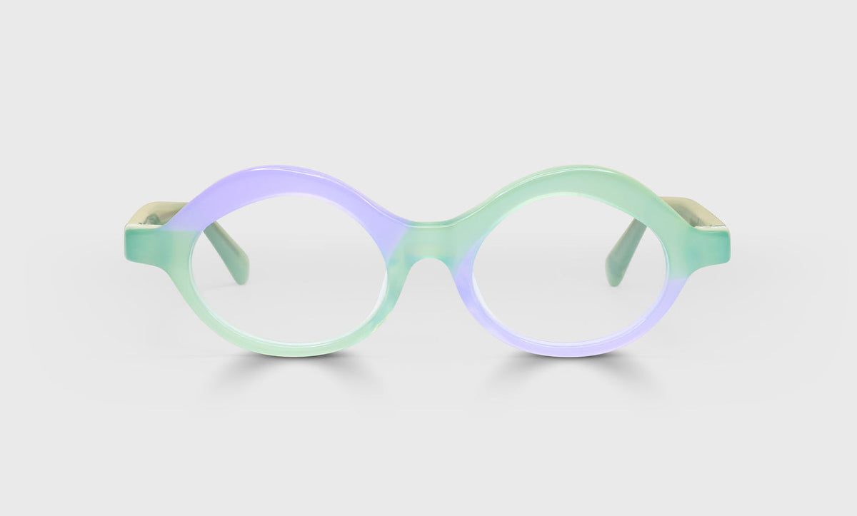 Unisex round eyeglasses featuring a sage green and soft purple acetate frame and temples on a pale gray background