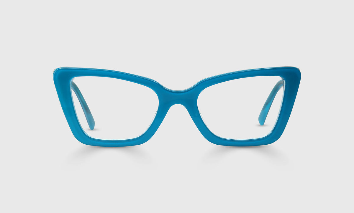 Cat-eye eyeglasses with solid teal acetate frame and temples displayed on a light gray background