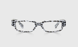Rectangular eyeglasses with black and white brick-patterned front and temples on a light gray background