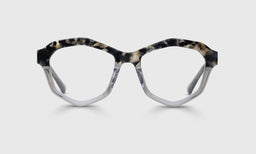 Geometric acetate eyeglasses with tortoise upper frame and translucent grey crystal lower front on light gray background
