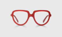 Wide oval eyeglasses with matte red-orange acetate frame and matching temples on light gray background