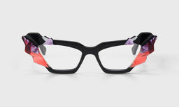 Cat-eye eyeglasses with black frame and sculptural mosaic temples in scarlet red, orchid purple, and asphalt black on gray background